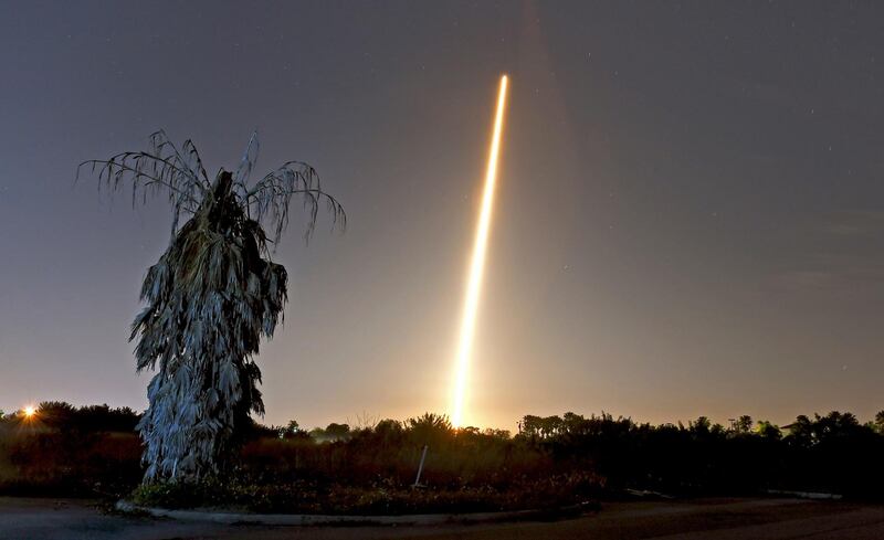 The SpaceX Falcon 9 rocket and Crew Dragon capsule launch from NASA pad 39A as seen in a time exposure from Viera, FL.  AP