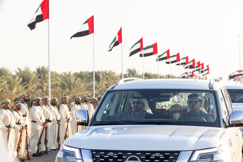 Sheikh Mohamed and Sheikh Mansour bin Zayed, Deputy Prime Minister and Minister of the Presidential Court, arrive at the Sheikh Zayed Heritage Festival to attend the Union Parade. Ryan Carter / Presidential Court 