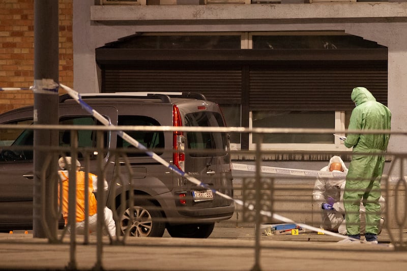 Police in the area where the shooting took place in the centre of Brussels. AP