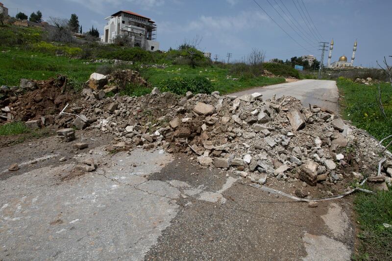 A bypass road that connects Ramallah with neighbouring villages is closed with rubble by Palestinian security forces to enforce new government measures against the coronavirus. AP Photo