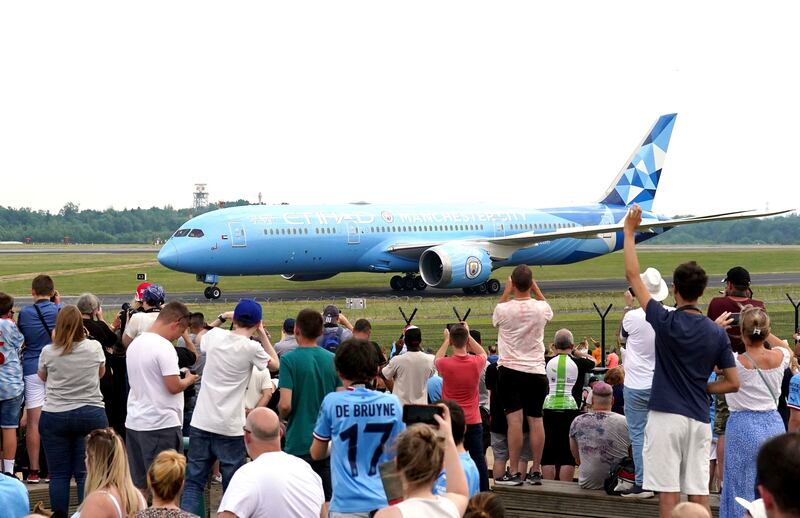 Manchester City players arriving at Manchester Airport after their victory in the Champions League final, in Manchester, England. AP