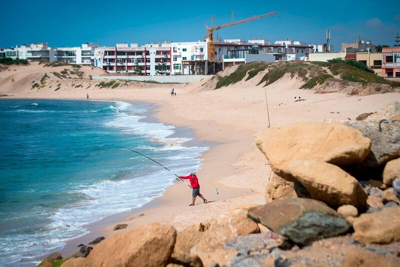 A Moroccan fishes on a beach in the city of Mohammedia. AFP