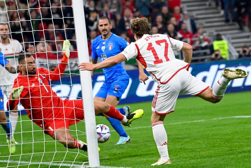 Italian goalkeeper Gianluigi Donnarumma, left, in action against Hungary's Callum Styles. AP