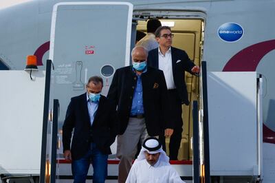 Siamak Namazi, Emad Sharqi and Morad Tahbaz disembark a plane in Qatar after being released from Iran under a deal agreed by the Biden administration. AFP 
