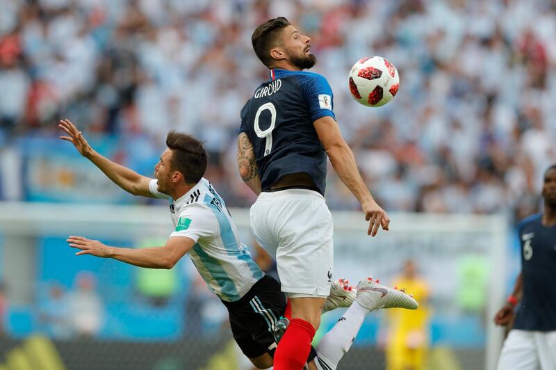 France's Olivier Giroud, right, fouls Argentina's Nicolas Tagliafico. Ricardo Mazalan/ AP Photo