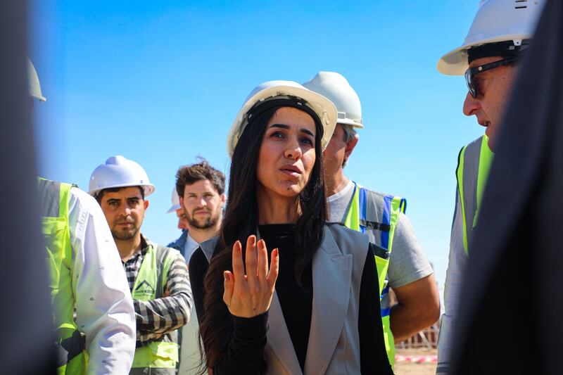 Nadia Murad visits one of the initiative's building projects in Sinjar in October 2022