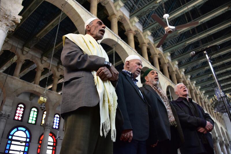 Syrian Muslim clergymen call for evening prayers at the Umayyad Mosque, the most ancient mosque in the old city of Damascus, Syria.  EPA