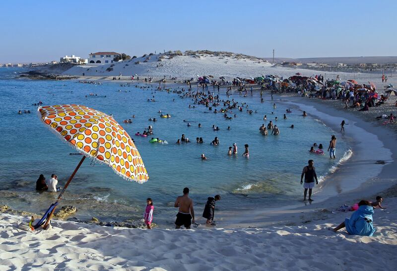 epa06182442 People crowd a beach in Marsa Matruh, northern Egypt, 03 September 2017. The coastal town of Marsa Matruh is a popular summer destination for Egyptians and Europeans. Its main tourist sights, aside the beaches, include ancient Egyptian ruins and a Rommel cave museum.  EPA/KHALED ELFIQI