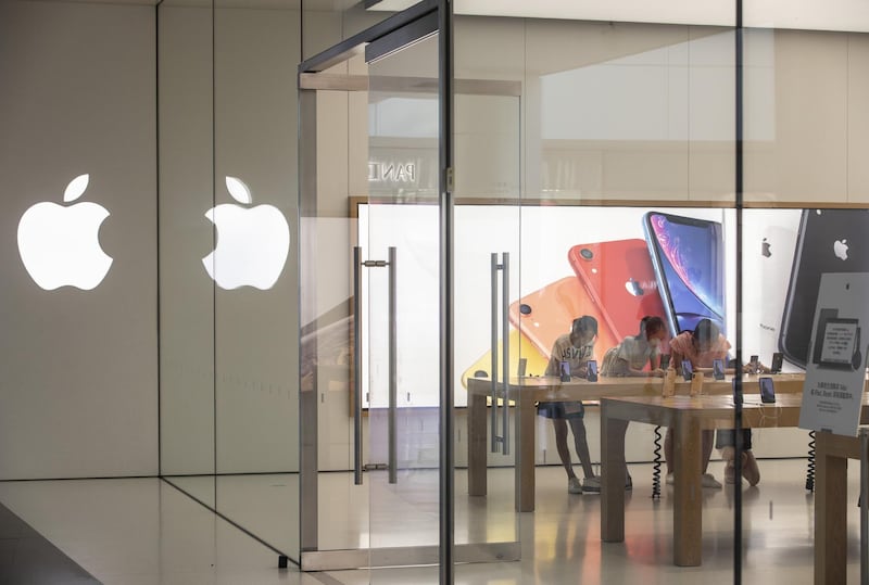 Customers browse products at an Apple store in Xiamen, China, on Monday, Aug. 26 2019. U.S. companies are concerned about President Donald Trump’s threats to ban them from doing business in China, and they’re poised to halt new investments if the trade war escalates, the leader of group of top chief executive officers said. Photographer: Qilai Shen/Bloomberg