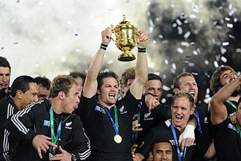 Richie McCaw lifts the Webb Ellis trophy as New Zealand ended their 24-year wait to win the Rugby World Cup.