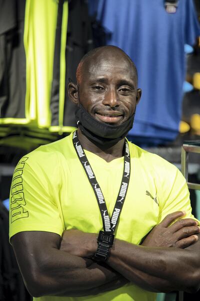 Souleymane Ghani, 36-year-old ultra-marathon runner during his work inside a Puma store in Dubai's Mall of the Emirates. Suhail Tather / The National 
