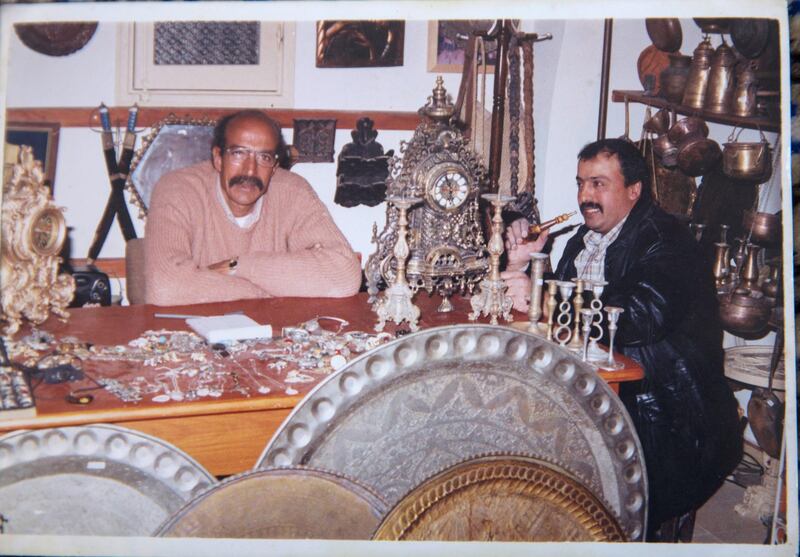 A personal photograph showing Palestinian merchant Joma Al Zaeem (left) in his copper shop , which was just s heavily damaged by an Israeli airstrike missiles  that damaged the ÒArts and Crafts Village , a museum managed by the City Council in Gaza. It was   founded by late Palestinian President Yasser Arafat in 1998, with financial support from the United Nations Development Program. Last Saturday Israeli planes carried out attacks on dozens of targets in the Gaza Strip in the most extensive Israeli military assault since the 2014 ÒOperation Protective EdgeÓ in which over 2,200 Palestinians were killed.
(Photo by Heidi Levine for The National).

