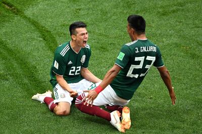 MOSCOW, RUSSIA - JUNE 17:  Hirving Lozano of Mexico celebrates with Jesus Gallardo by sliding on their knees after scoring his team's first goal during the 2018 FIFA World Cup Russia group F match between Germany and Mexico at Luzhniki Stadium on June 17, 2018 in Moscow, Russia.  (Photo by Matthias Hangst/Getty Images) *** BESTPIX ***