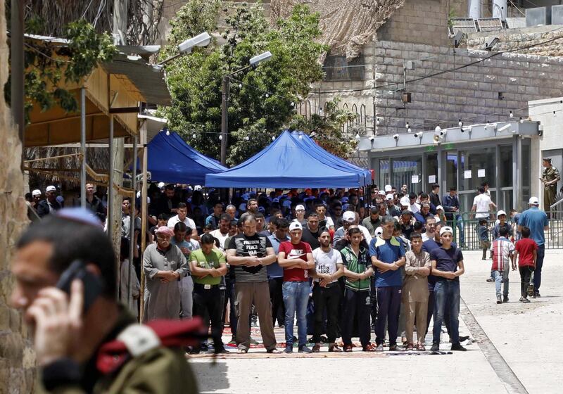 Palestinians attending Friday prayers during Ramadan in the West Bank city of Hebron, the West Bank, 17 May 2019. According to local media, Israeli security officers allegedly arranged shuttle services to allow worshipers easy access to the Muslim holy site. EPA