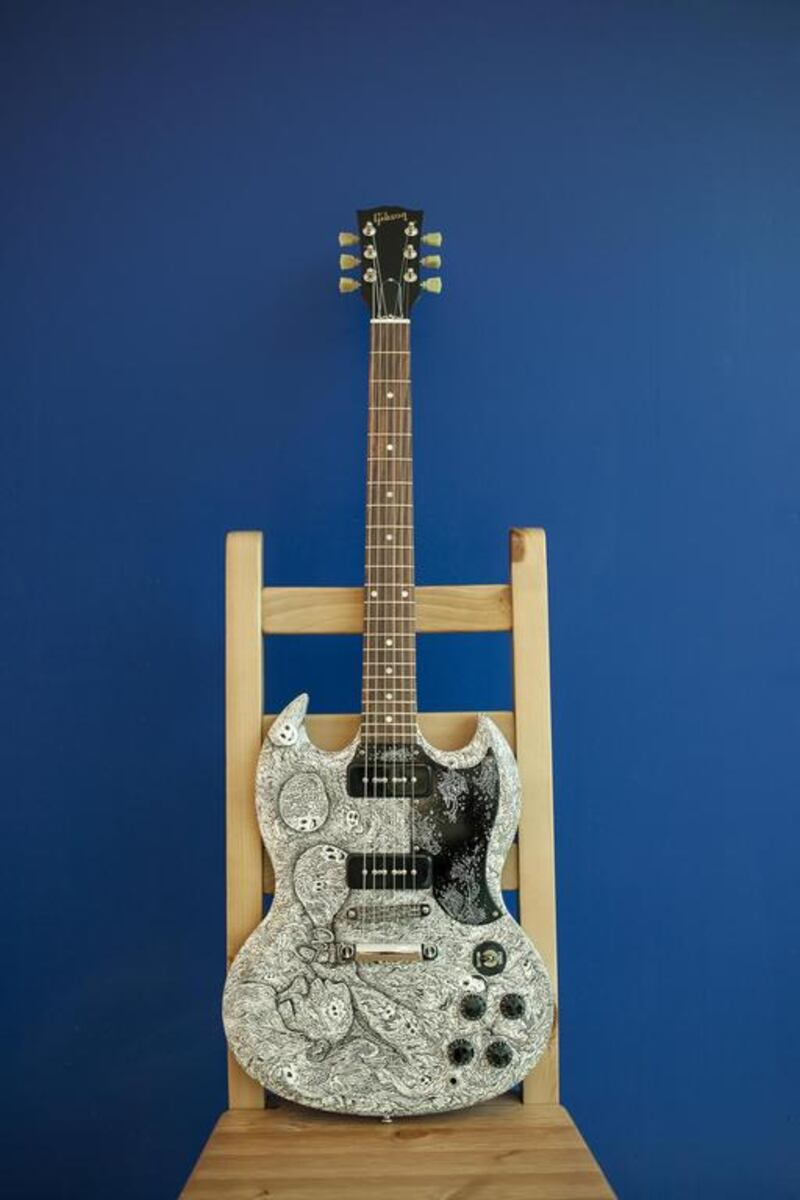 An SG Gibson guitar decorated by artist Kristy Anne Ligones from the Philippines titled Blow Bubbles On The Otherside. Antonie Robertson / The National