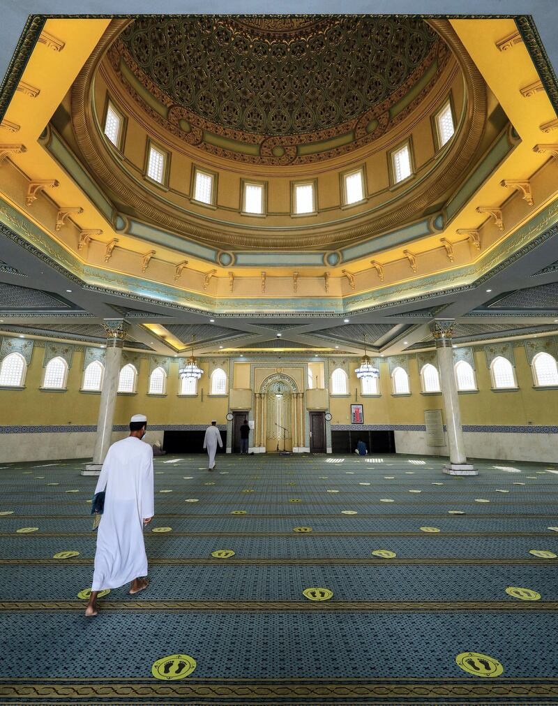 Abu Dhabi, United Arab Emirates, August 3, 2020.   
Worshippers arrive at the Bani Hashim Mosque at the Al Maqta area during the first day restrictions have been eased on Mosque's in Abu Dhabi to allow 50% occupancy.
Victor Besa /The National
Section: NA
Reporter: