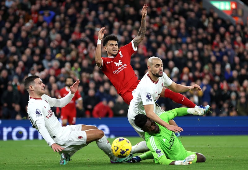 Luis Diaz of Liverpool has a shot blocked by Sofyan Amrabat and Andre Onana of Manchester United. Getty Images