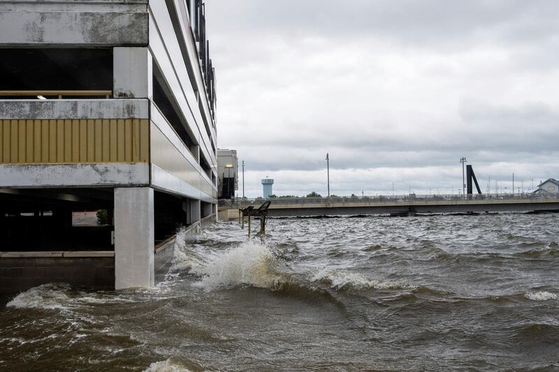 Storm surge from Hurricane Sally overtakes the outside parking lot and the first floor of the Palace casino parking garage in Biloxi, Mississippi.  AP