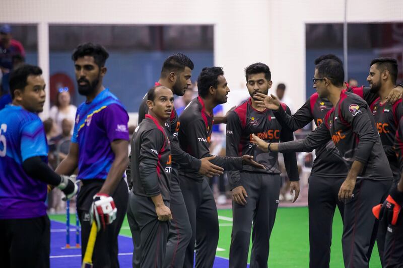 Dubai, United Arab Emirates - September 21st, 2017: Isuru Umesh of the UAE takes a wicket during the game between the UAE v Malaysia in the W.I.C.F Indoor cricket world cup 2017. Thursday, Sept 21st, 2017, Insportz, Al Quoz, Dubai. Chris Whiteoak / The National