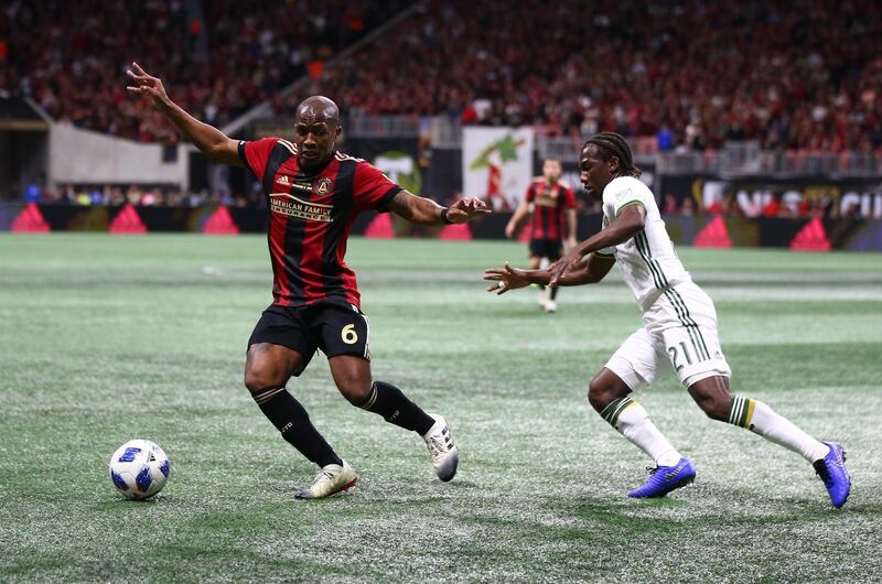 Atlanta United's Darlington Nagbe chases the ball with Portland Timbers' Diego Chara. Reuters