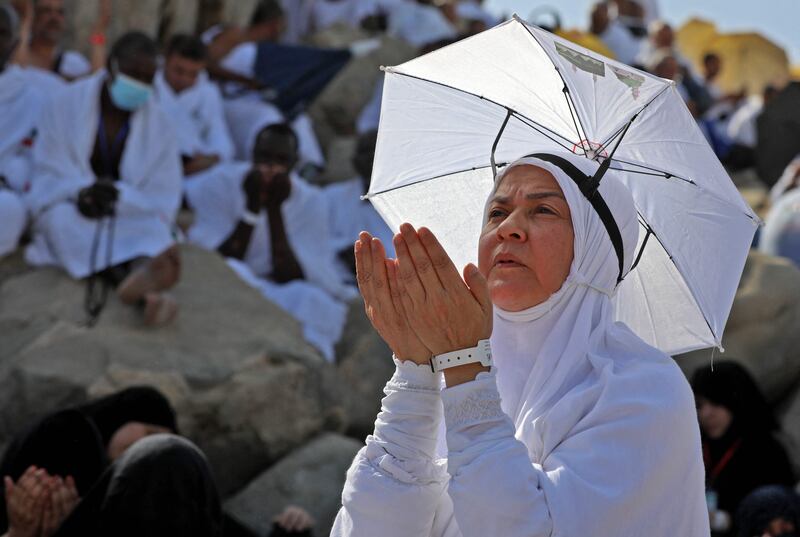 A Muslim woman prays atop Mount Arafat. AFP