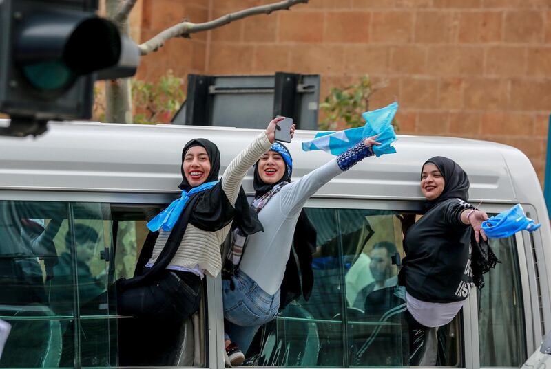 Supporters of Lebanon's al-Mustaqbal ('Future') movement wave their flags while riding on a bus as they arrive to attend the 15th anniversary commemoration of the assassination of former Lebanese Prime Minister Rafic Hariri in Beirut, Lebanon.  EPA