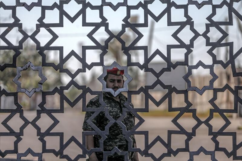 A Hamas Palestinian security guard stands at the closed entry to Rafah border crossing with Egypt, southern Gaza Strip. EPA