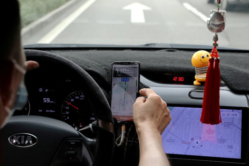 A Didi driver in Beijing. The Chinese ride-hailing company is placing its European expansion plans on hold for a year. Reuters