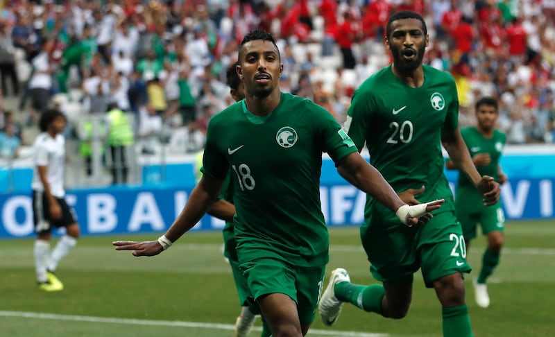 Saudi Arabia's Salem Aldawsari, centrr, celebrates after scoring his side's second goal against Egypt. Darko Vojinovic /AP Photo