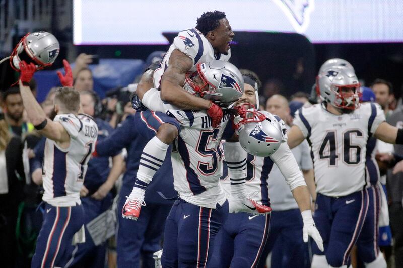 Patriots players celebrate their sixth Super Bowl title. AP Photo
