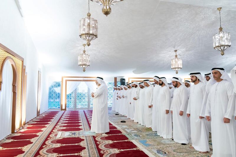 DUBAI, UNITED ARAB EMIRATES - May 19, 2019: HH Sheikh Mohamed bin Zayed Al Nahyan, Crown Prince of Abu Dhabi and Deputy Supreme Commander of the UAE Armed Forces (front row 5th R), prays after an iftar reception hosted by HH Sheikh Mohamed bin Rashid Al Maktoum, Vice-President, Prime Minister of the UAE, Ruler of Dubai and Minister of Defence ( front row 4th L), at Zabeel Palace. Seen with (front R-L) HH Lt General Sheikh Saif bin Zayed Al Nahyan, UAE Deputy Prime Minister and Minister of Interior, HH Sheikh Hamdan bin Mohamed Al Maktoum, Crown Prince of Dubai and HH Sheikh Hamdan bin Zayed Al Nahyan, Ruler’s Representative in Al Dhafra Region.

( Mohamed Al Hammadi / Ministry of Presidential Affairs )
---