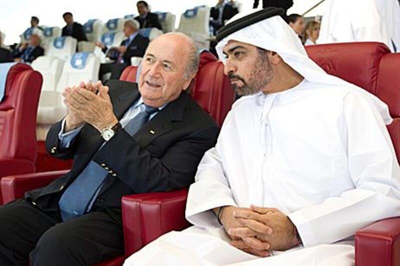 Sepp Blatter, left, the Fifa president, alongside Sheikh Hamdan bin Mubarak, Minister for Public Works, applauds during the Seongnam-Inter Milan match on Wednesday. Blatter yesterday complimented the UAE for organising another successful Club World Cup.