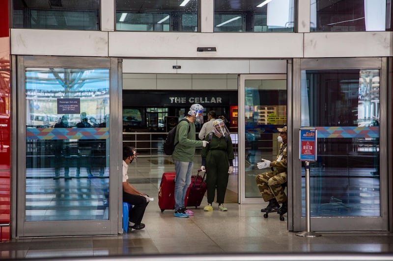 DELHI, INDIA - MAY 26: Indian travelers arrive  at the drop-off point of Terminal 3 of the Indira Gandhi International Airport, as the country relaxed its lockdown restriction on May 26, 2020 in Delhi, India. With a slew of guidelines for passengers, India allowed commercial domestic flights to resume operations on May 25 for the first time since imposing a nationwide lockdown on March 25 to curb the spread of coronavirus, which has reportedly claimed around 4,000 lives in India so far.  (Photo by Yawar Nazir/Getty Images)