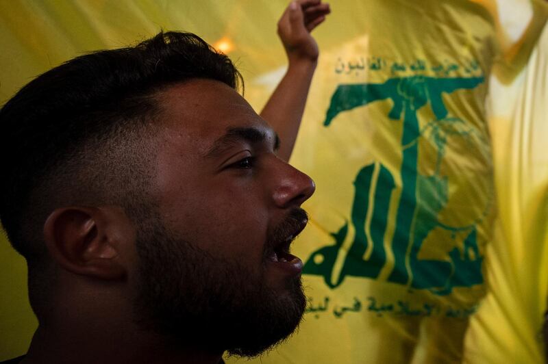 A Hezbollah and Amal supporter shouts slogans against Israel and US during a protest in the southern suburb of Beirut. AP