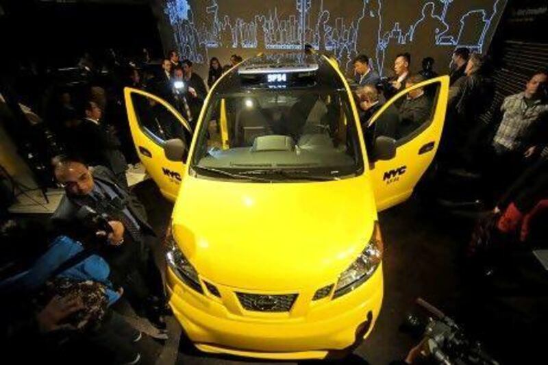 Nissan unveiled the NV200 minivan taxi for New York to a throng of reporters usually associated with a Lamborghini or Ferrari launch. Peter Foley/Bloomberg