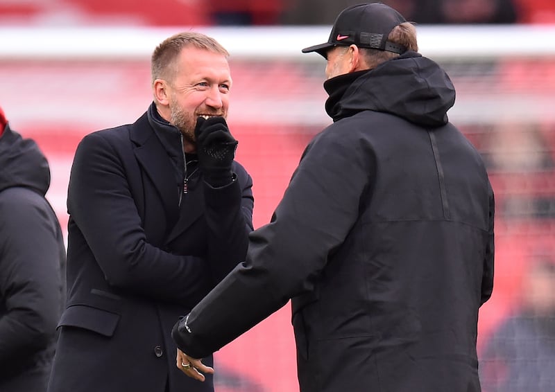 Chelsea manager Graham Potter and Liverpool's Jurgen Klopp talk prior to the match. EPA