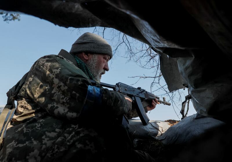 A Ukrainian fighter on the front line in the north Kyiv region. Reuters