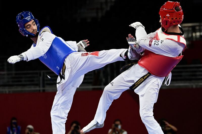 Tunisia's Mohamed Khalil Jendoubi (Blue) won silver in the taekwondo men's 58kg event..