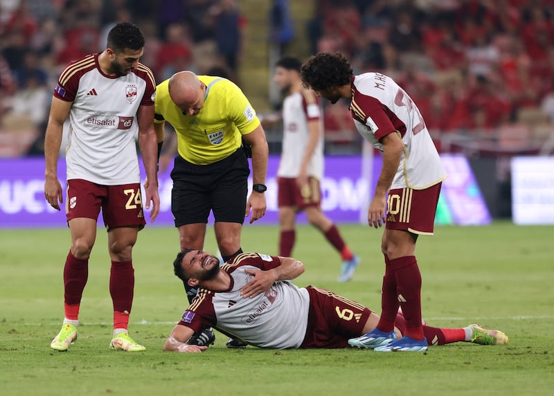 Al Ahly's Yasser Ibrahim reacts after being injured. Reuters