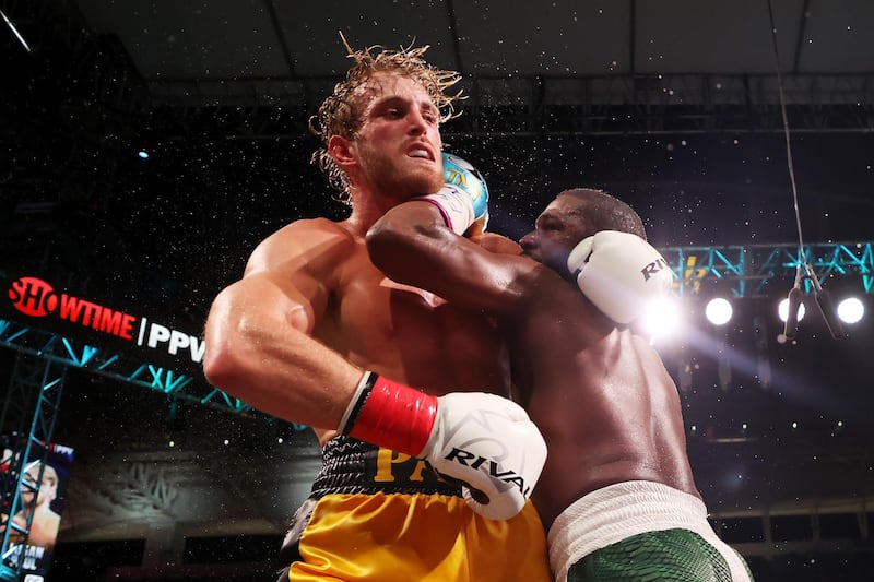 Floyd Mayweather exchanges blows with Logan Paul during their exhibition bout at Hard Rock Stadium. AFP