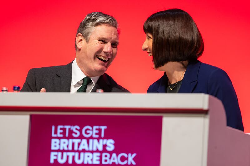 Mr Starmer speaks to shadow chancellor Rachel Reeves before she delivers a speech to the Labour conference in Liverpool. Getty Images