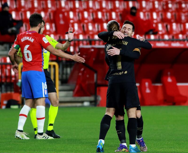 Griezmann (front) celebrates with teammate Lionel Messi. EPA