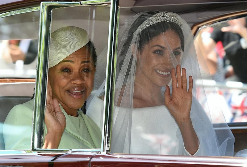 Meghan Markle (R) and her mother, Doria Ragland, arrive for her wedding ceremony to marry Britain's Prince Harry, Duke of Sussex, at St George's Chapel, Windsor Castle, in Windsor, on May 19, 2018. (Photo by Oli SCARFF / AFP)