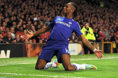 MANCHESTER, ENGLAND - OCTOBER 26: Didier Drogba of Chelsea celebrates scoring the first goal during the Barclays Premier League match between Manchester United and Chelsea at Old Trafford on October 26, 2014 in Manchester, England. (Photo by Laurence Griffiths/Getty Images)