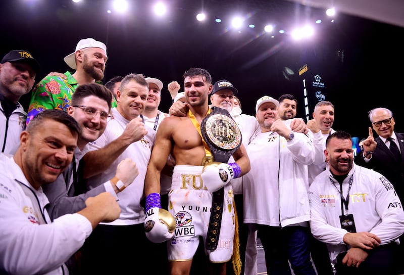 Tommy Fury celebrates with his team and Tyson Fury after winning his fight against Jake Paul. Reuters