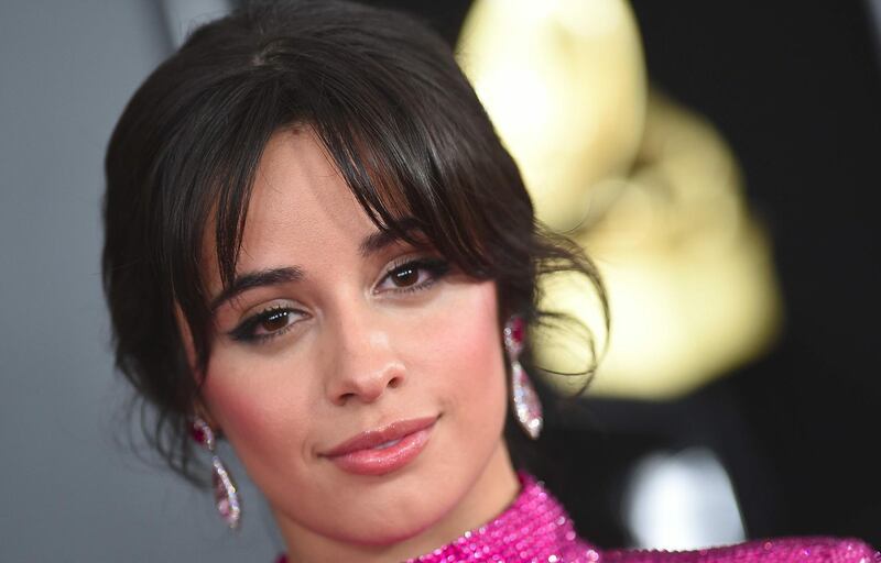 (FILES) In this file photo taken on February 10, 2019 US-Cuban singer-songwriter Camila Cabello arrives for the 61st Annual Grammy Awards in Los Angeles.  Cuban-American singer Camila Cabello will try on the glass slipper when she takes on the lead role in a remake of "Cinderella," a source close to the project said Tuesday April 9, 2019. / AFP / VALERIE MACON
