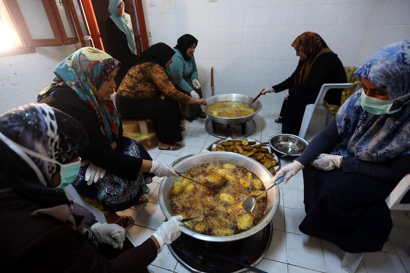 Women prepare Iftar meals for fighters from the Libyan Government of National Accord (GNA) in Misrata, a town half-way between Sirte and the capital Tripol. AFP
