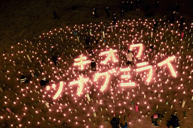 Candles spell out "memory" and "connecting future" at the Great East Japan Earthquake and Nuclear Disaster Memorial Museum to mark the 10th anniversary of a 9.0-magnitude earthquake that caused a tsunami and nuclear disaster, killing about 16,000 people. AFP