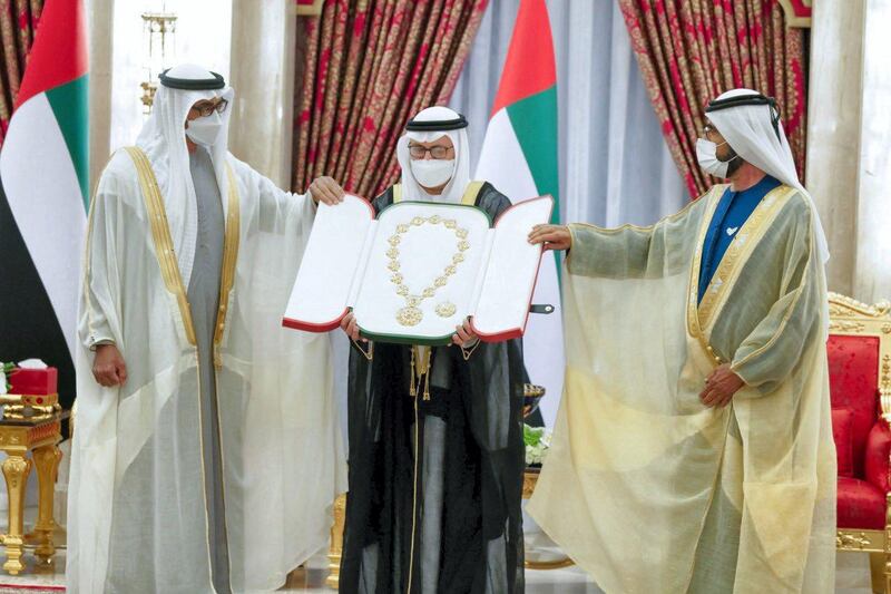 Sheikh Mohammed bin Rashid, right, thanks Dr Anwar Gargash for his service in the foreign ministry. He takes up a new role advising the President, Sheikh Khalifa, on diplomatic affairs. Courtesy of UAE Government