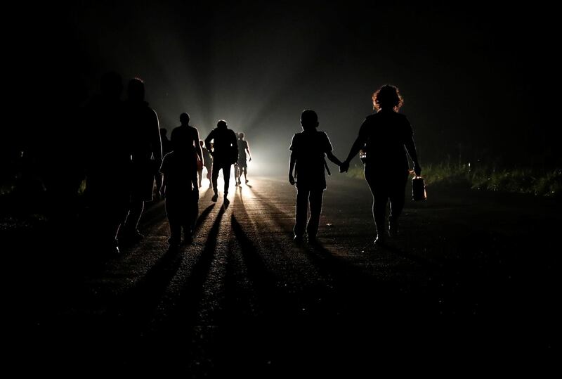 Migrants walk north from Huixtla, Mexico. Reuters